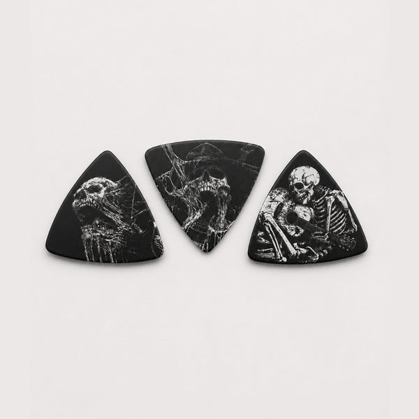 DORTI Boneyard Collection variety pack: three black triangle Delrin guitar picks with skeleton art