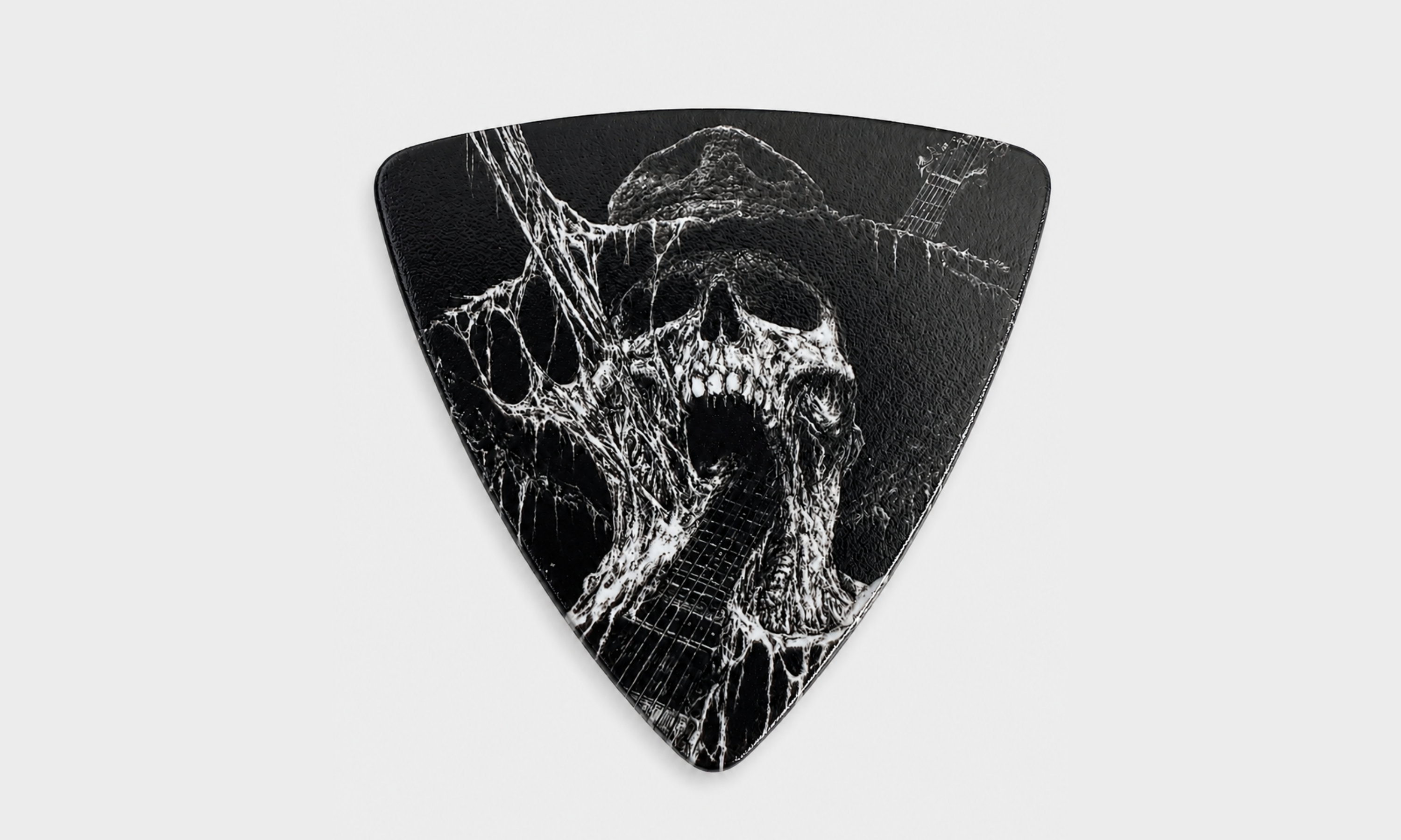 DORTI Neck Feeder Pro Series triangle Delrin guitar pick with a screaming skull in cobwebs