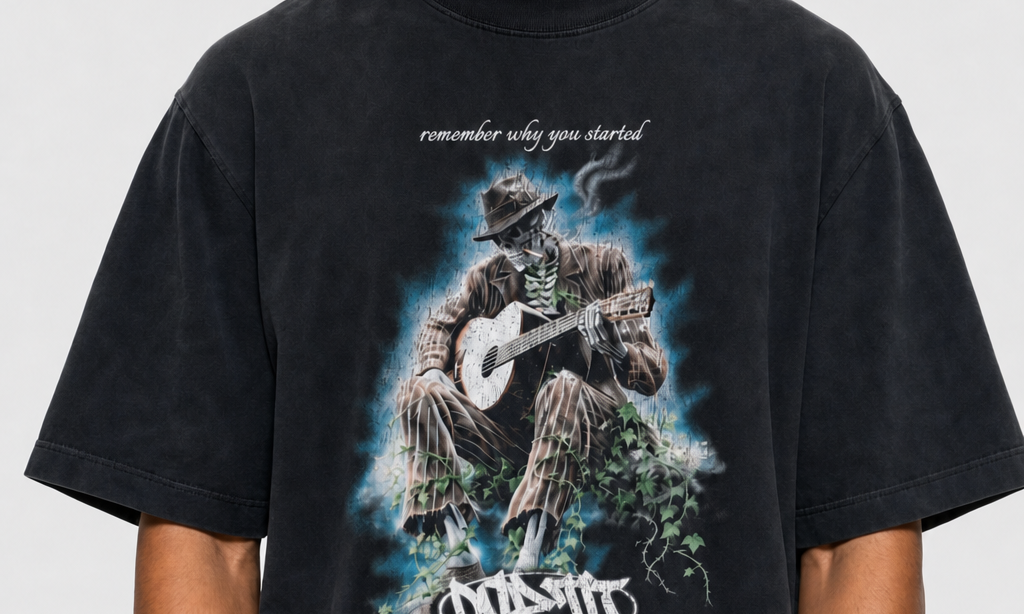 Model in the DORTI Remember Why You Started skeleton guitarist tee, close crop