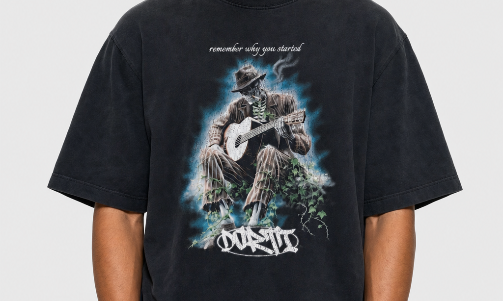 Model wearing the DORTI Remember Why You Started guitar graphic tee