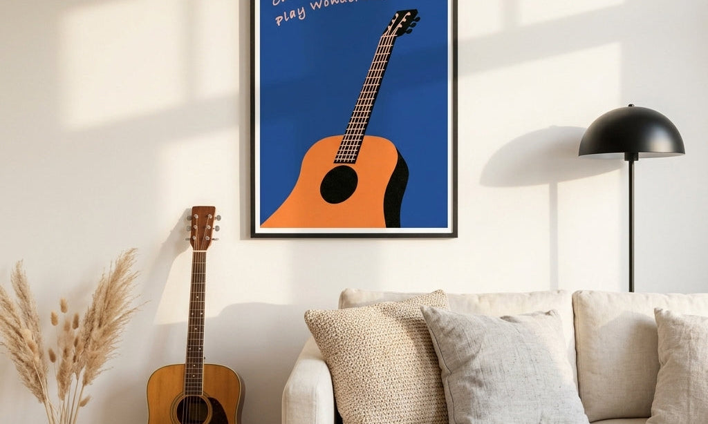 DORTI Will Play Wonderwall guitar poster hanging above a sofa next to an acoustic guitar