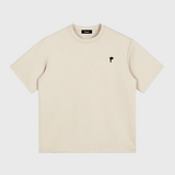 Beige DORTI t-shirt with a small black logo on a white background