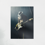 DORTI poster of a Jimi Skull playing guitar with a hat on a dark background