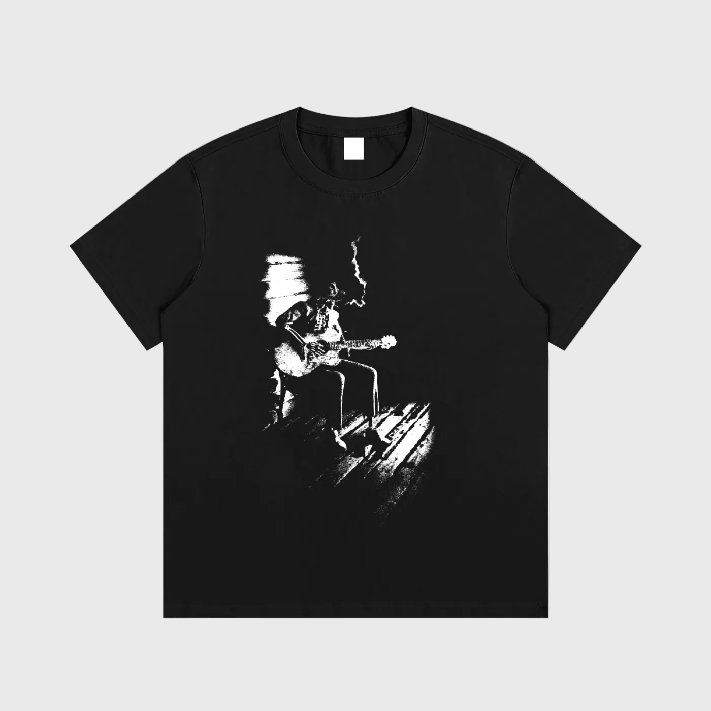 Black DORTI t-shirt with a graphic of a person playing guitar on a white background