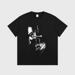 Black DORTI t-shirt with a graphic of a person playing guitar on a white background