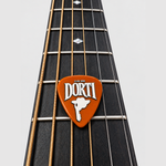 DORTI Standards nylon guitar pick on an acoustic guitar neck, close-up