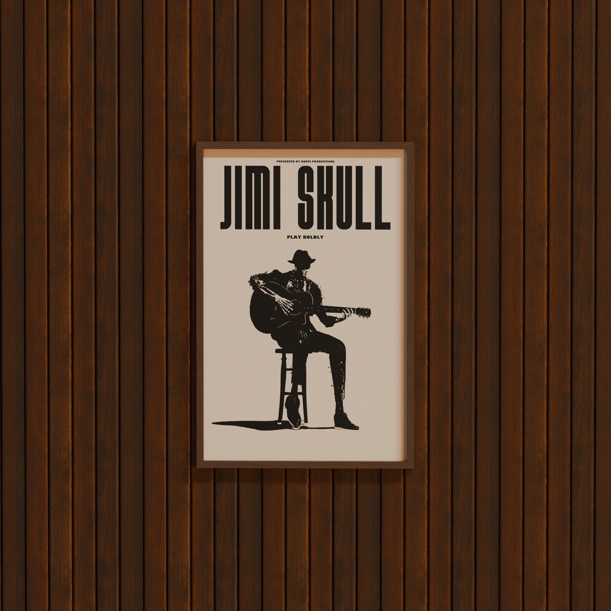 DORTI Jimi Skull Play Boldly poster in a wooden frame on a dark wood wall