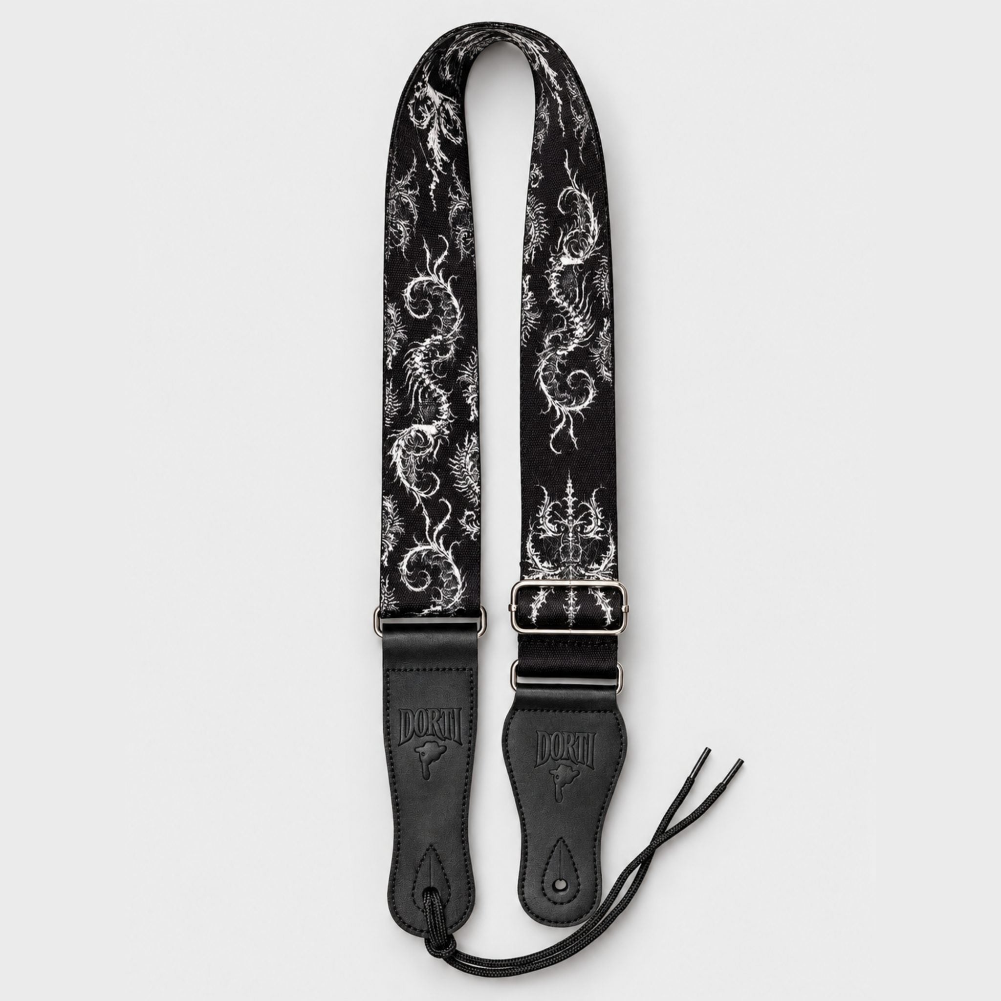 DORTI Signature guitar strap: black woven strap with white skeleton artwork and black leather ends