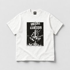DORTI I Sold My Soul to Play Guitar white graphic tee: a horned devil playing guitar at a crossroads sign