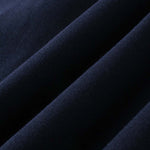Close-up of dark blue DORTI fabric with a textured surface