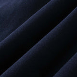 Close-up of dark blue DORTI fabric with a textured surface