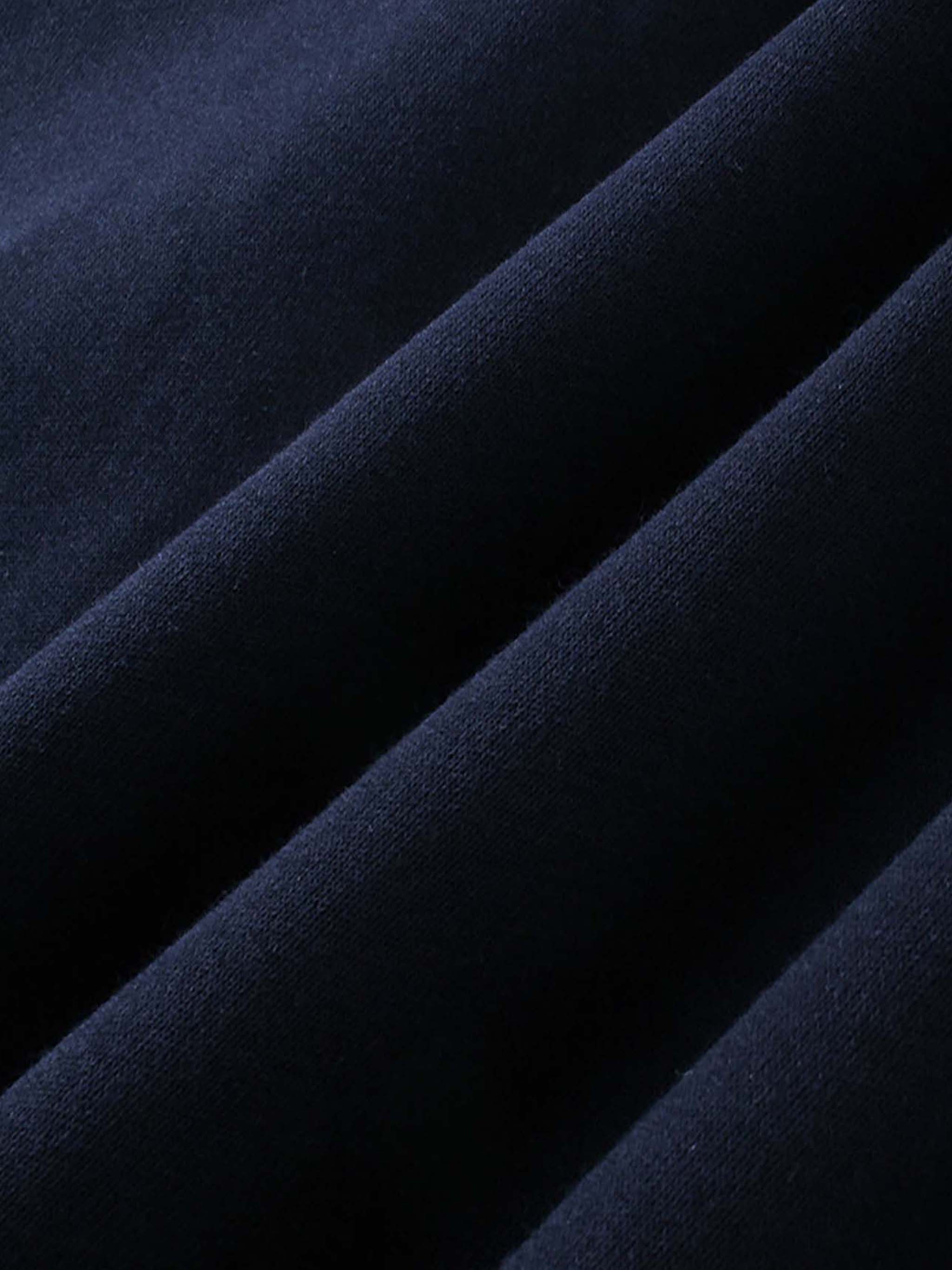Close-up of dark blue DORTI fabric with a textured surface