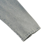 Close-up of a folded DORTI denim sleeve on a white background