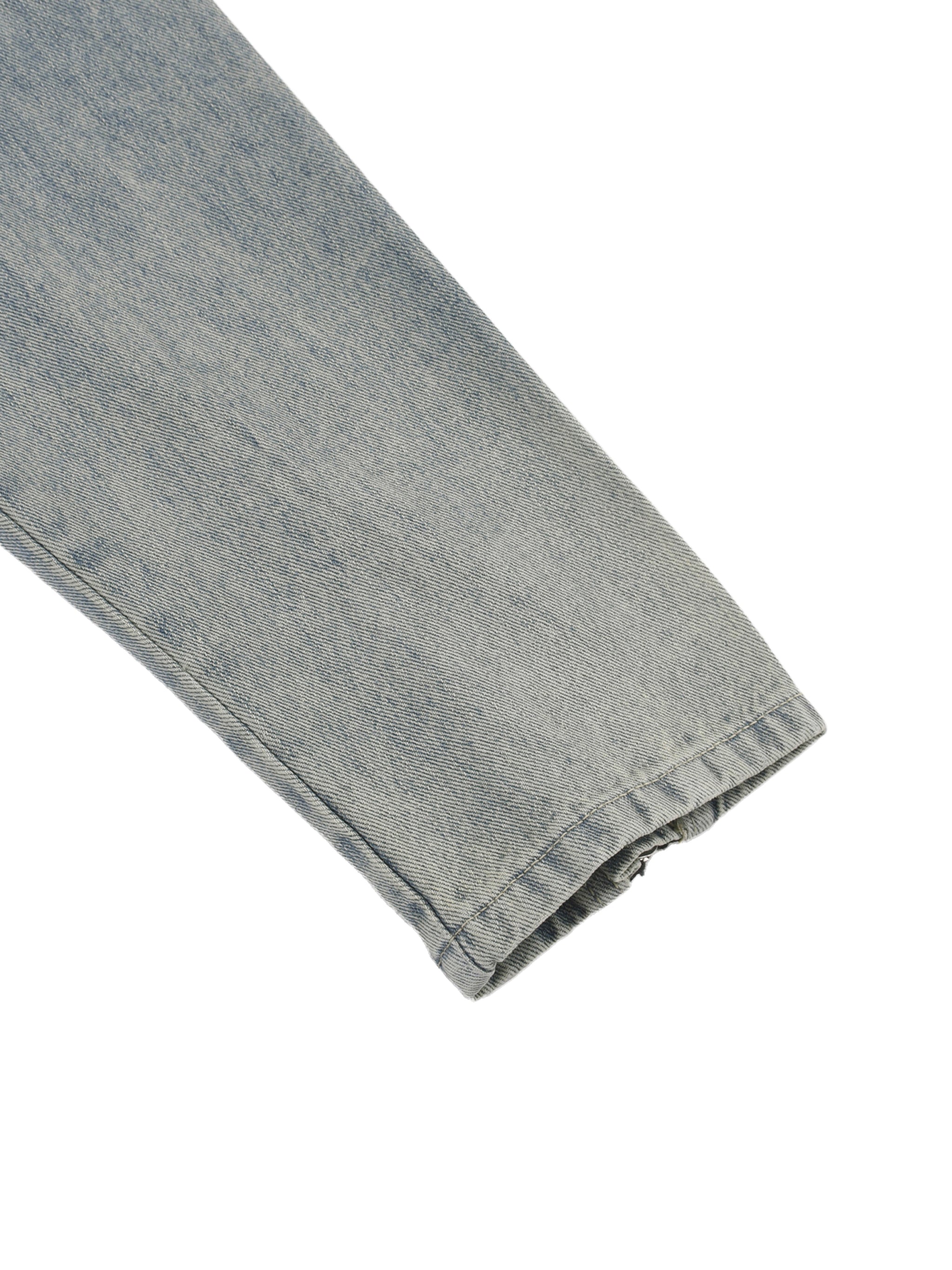 Close-up of a folded DORTI denim sleeve on a white background