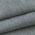 Close-up of the DORTI blue denim jacket with a subtle pattern