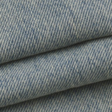 Close-up of the DORTI blue denim jacket with a subtle pattern