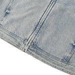 Close-up of a light blue DORTI denim jacket with visible stitching on a white background