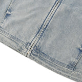 Close-up of a light blue DORTI denim jacket with visible stitching on a white background